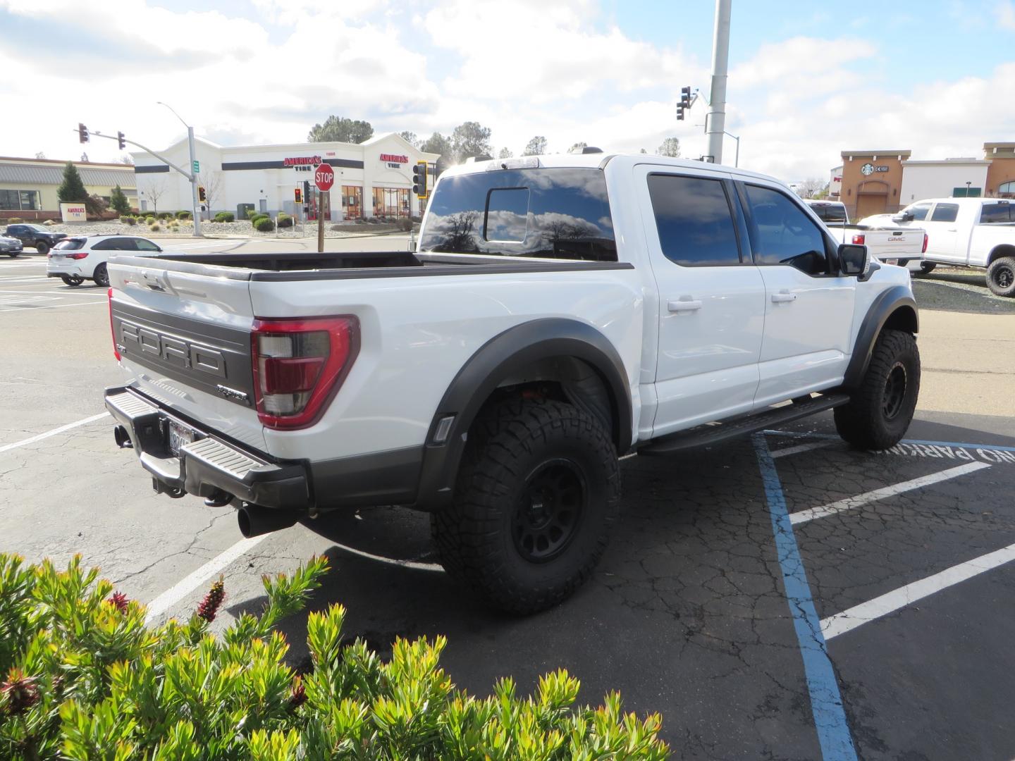 2023 White /BLACK Ford F-150 Raptor SuperCrew 4WD (1FTFW1RG6PF) with an 3.5 V6 engine, 6A transmission, located at 2630 Grass Valley Highway, Auburn, CA, 95603, (530) 508-5100, 38.937893, -121.095482 - Raptor sitting on Eibach front and rear springs, 37" Nitto Ridge Grappler tires, 17" Method NV wheels, and window tint. - Photo#4